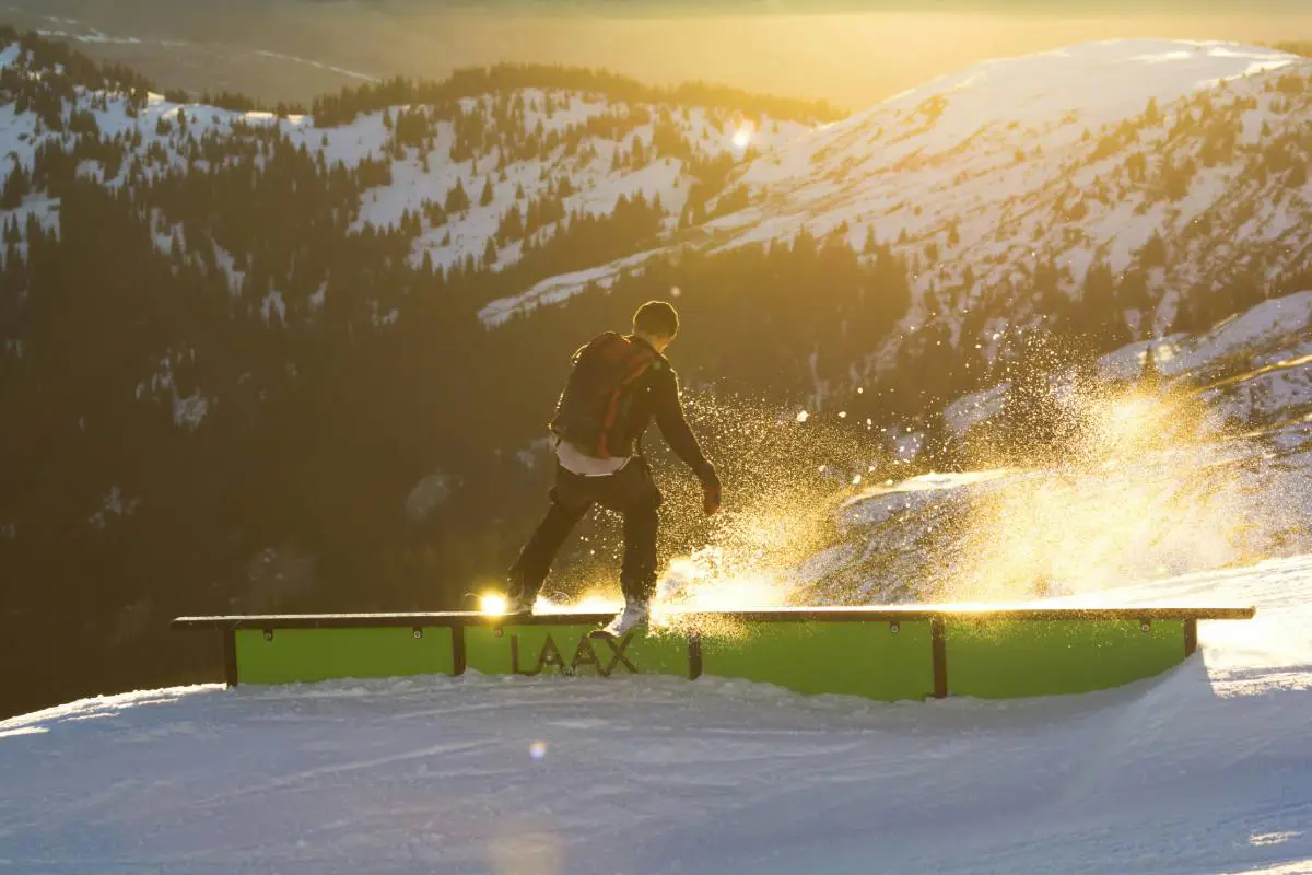 Skier practising on the box rails at Laax fun park in Switzerland. Photo by Jorg Angeli from Unsplash