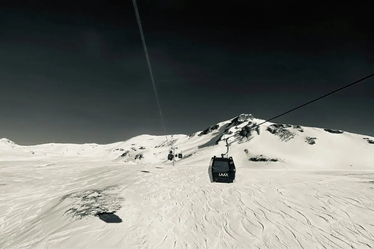 Gondola at Laax ski resort in Switzerland transporting passengers up the mountain. Photo by J Producer from Unsplash